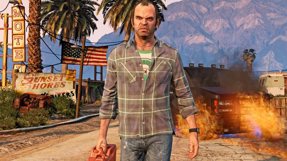 Trevor Philips walking away from a burning trailer in the desert in GTA V